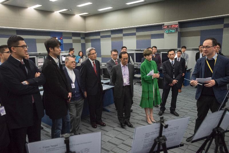 Members of the Legislative Council are briefed on the operation of the Air Traffic Control Radar Simulator by a representative of the Civil Aviation Department today (March 15).