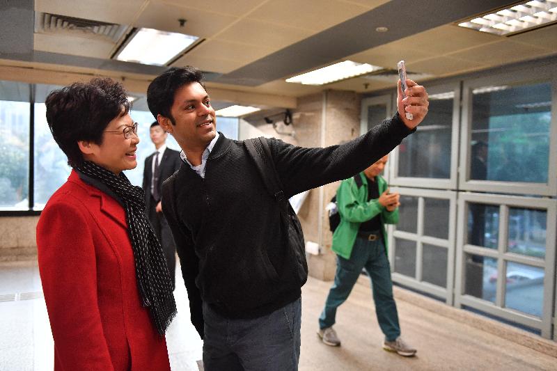 The Chief Executive-elect, Mrs Carrie Lam (left), takes a photo with a member of the public in Wan Chai this morning (March 27).