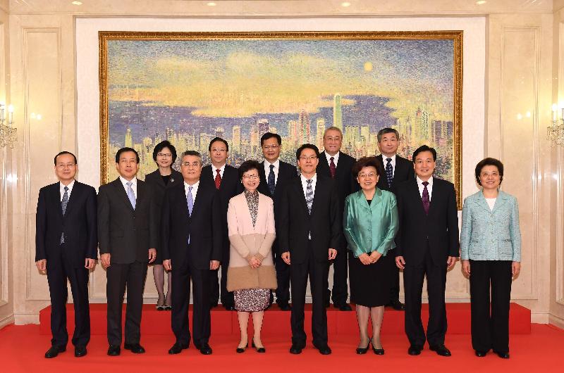 The Chief Executive-elect, Mrs Carrie Lam (front row, fourth left), is pictured with the Director of the Liaison Office of the Central People's Government in the Hong Kong Special Administrative Region, Mr Zhang Xiaoming (front row, fourth right); the Secretary-General of the Office of the Chief Executive-elect, Mrs Jessie Ting (second row, first left); and other officials of the Liaison Office today (March 29).