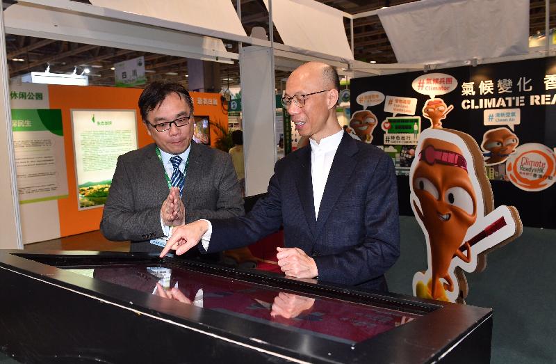 The Secretary for the Environment, Mr Wong Kam-sing (right), visits the booth hosted by the Environment Bureau at the 2017 Macao International Environmental Co-operation Forum & Exhibition in Macau today (March 30).