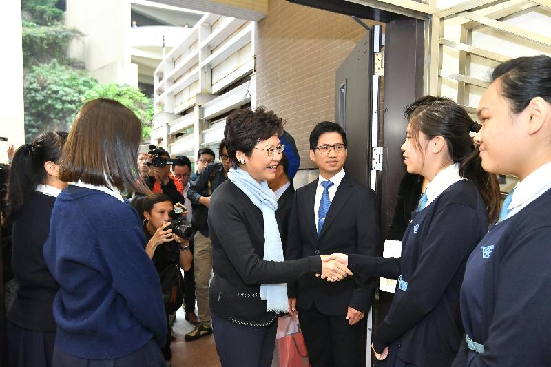 The Chief Executive-elect, Mrs Carrie Lam, visited her alma mater St Francis' Canossian College this morning (March 30). Photo shows Mrs Lam (fourth right) being greeted by the Principal, Mr Kenneth Law (third right), and a group of students when arriving at the school.