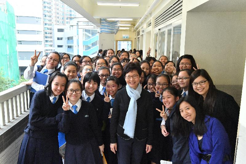 The Chief Executive-elect, Mrs Carrie Lam, visited her alma mater St Francis' Canossian College this morning (March 30). Photo shows Mrs Lam with students.