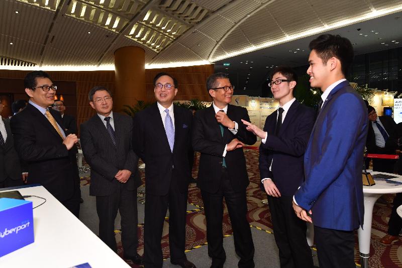 The Financial Secretary, Mr Paul Chan (third right), accompanied by the Secretary for Innovation and Technology, Mr Nicholas W Yang (third left), tours the Winners’ Showcase of the eight Grand Awards at the Hong Kong ICT Awards 2017 Awards Presentation Ceremony tonight (April 7). Looking on are the Permanent Secretary for Innovation and Technology, Mr Cheuk Wing-hing (second left); and the Government Chief Information Officer, Mr Allen Yeung (first left).