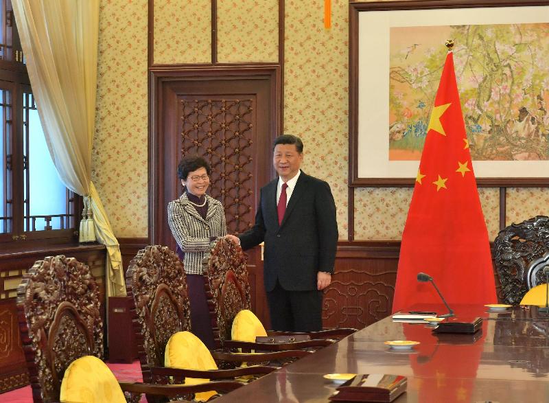 The Chief Executive-elect, Mrs Carrie Lam (left), is received by President Xi Jinping (right) in Beijing today (April 11). 