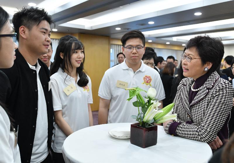 The Chief Executive-elect, Mrs Carrie Lam (first right), meets Hong Kong people who work and study in Beijing this evening (April 11).