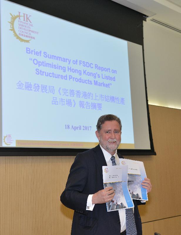 A council member of the Financial Services Development Council, Mr Mark Dickens, releases a report entitled "Optimising Hong Kong's Listed Structured Products Market" at a press conference today (April 18).