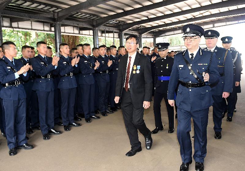The Chairman of the Action Committee Against Narcotics, Dr Ben Cheung, accompanied by the Commissioner of Police, Mr Lo Wai-chung, meets the graduates after the passing-out parade.

