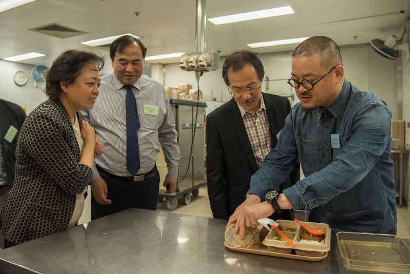 Members of the Legislative Council, Mr Shiu Ka-chun (first right) and Dr Fernando Cheung (second right), visit the kitchen of the Tuen Mun Children and Juvenile Home to get to know the meal provided for the residents and take a chance to taste the food today (April 28).