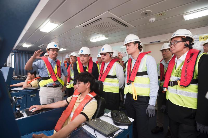 Members of the Legislative Council Subcommittee to Follow Up Issues Relating to the Three-runway System (3RS) at the Hong Kong International Airport receive a briefing on the construction progress of the 3RS reclamation works by a representative of the Airport Authority Hong Kong today (May 5).