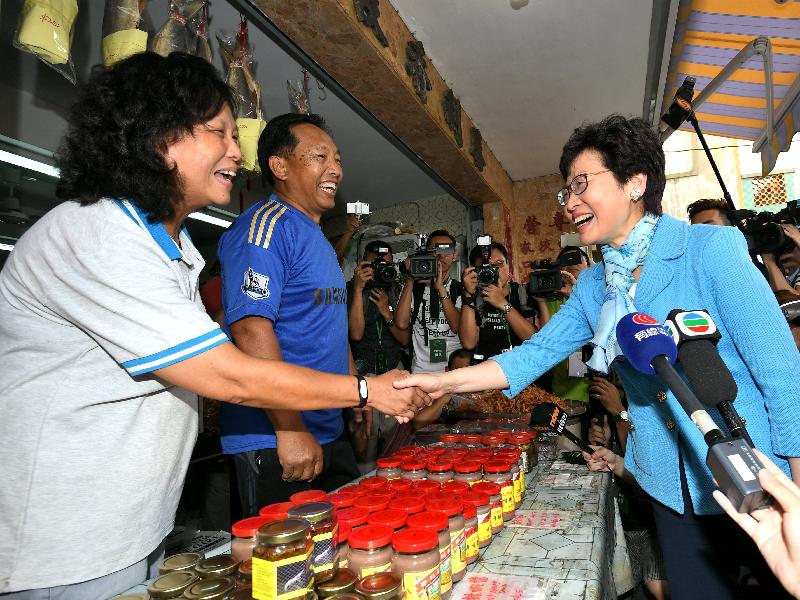 The Chief Executive-elect, Mrs Carrie Lam (right), chats with shop owners in Tai O during her visit to Tai O today (May 5).
