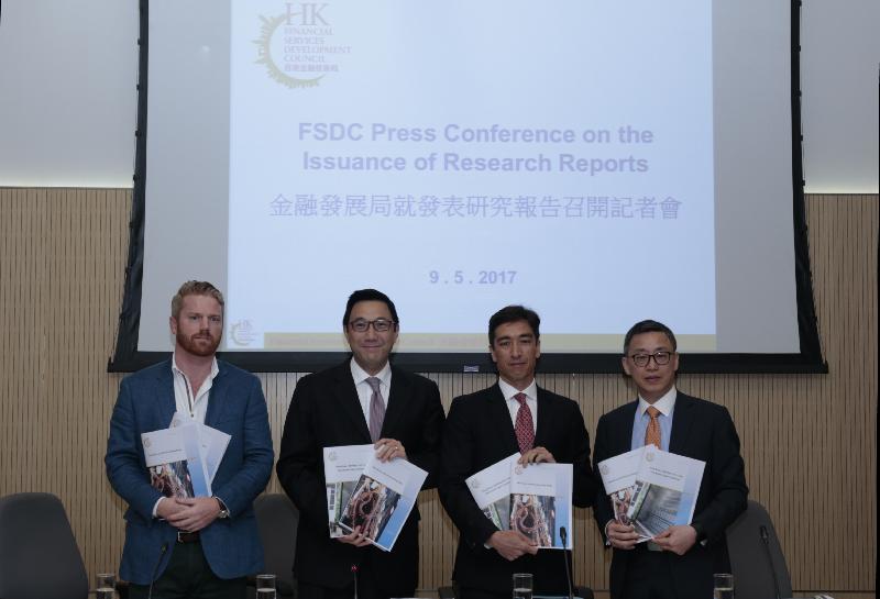 The Convenor of the Financial Services Development Council (FSDC)'s Policy Research Committee, Mr Laurence Li (second left), members of the FSDC New Business Committee Mr Christophe Lee (second right) and Mr James Lloyd (first left), and member of the FSDC Market Development Committee Dr Au King-lun (first right) released two reports entitled "The Future of FinTech in Hong Kong" and "Hong Kong - Building Trust Using Distributed Ledger Technology" at a press conference today (May 9).