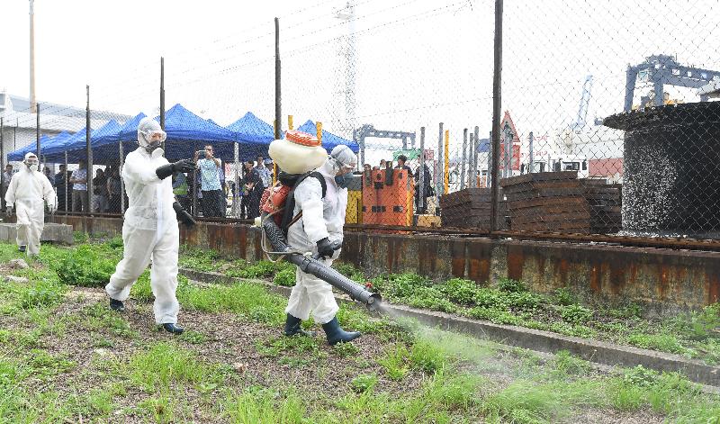 The Government tested its preparedness for a possible detection of Zika Virus Infection today (May 12) during an exercise code-named "Moonstone", organised by the Centre for Health Protection (CHP) of the Department of Health (DH) in collaboration with other government departments and organisations at the Container Terminal 8 West, Kwai Chung, Hong Kong. Photo shows personnel of the Food and Environmental Hygiene Department eradicating infective vectors by insecticide fogging.
