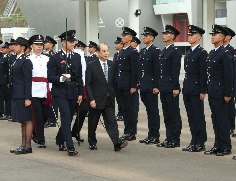 The Chief Secretary for Administration, Mr Matthew Cheung Kin-chung, reviews the 178th Fire Services passing-out parade at the Fire and Ambulance Services Academy today (May 12).
