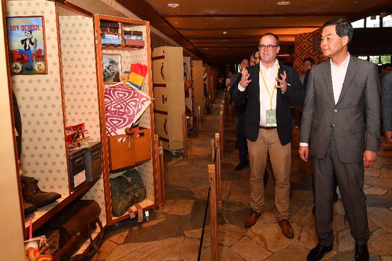 The Chief Executive, Mr C Y Leung, attended the opening ceremony of Disney Explorers Lodge today (May 16). Photo shows Mr Leung (first right) touring the hotel's facilities.