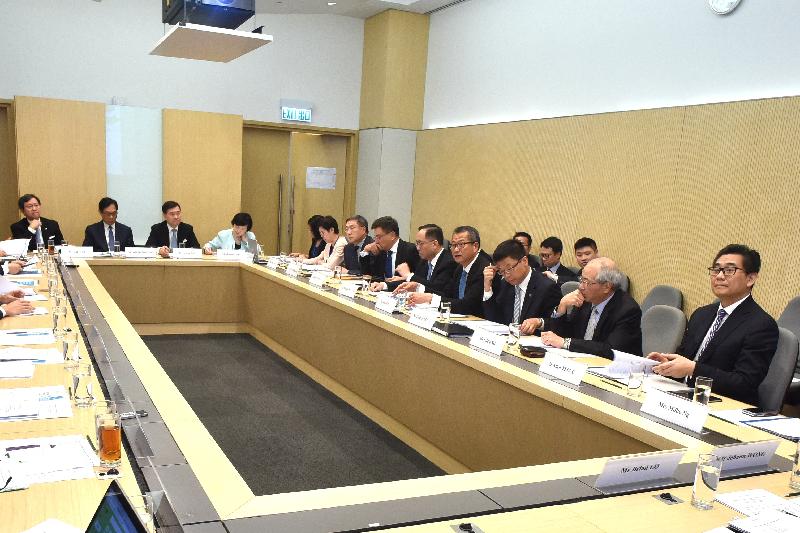The Financial Secretary, Mr Paul Chan (fourth right), chairs the first meeting of Committee on Innovation, Technology and Re-industrialisation today (May 16).