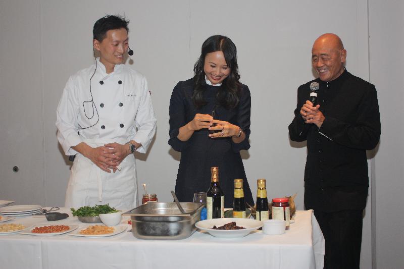 Internationally renowned Chinese chefs, Mr Ken Hom (right) and Ms Huang Ching-he (centre) demonstrate the making of Dragon Boat Festival rice dumplings at the launch of the Hong Kong's Intangible Cultural Heritage Festival, supported by the Hong Kong Economic and Trade Office, London, in London on May 15 (London time).