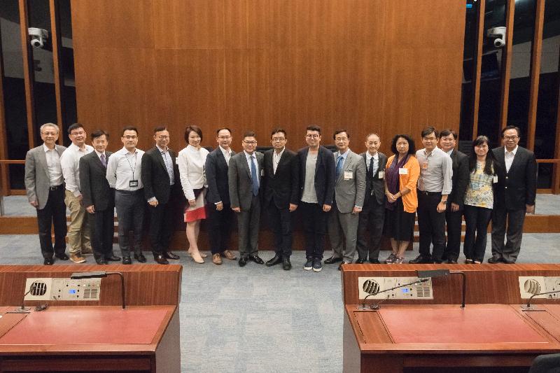 Members of the Legislative Council (LegCo) are pictured with members of Central and Western District Council at the LegCo Complex today (May 26).