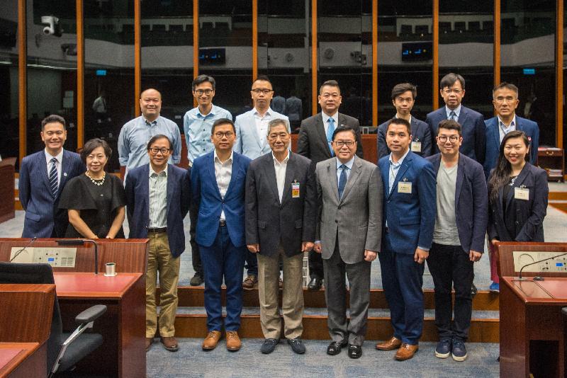 Members of the Legislative Council (LegCo) are pictured with members of Tsuen Wan District Council at the LegCo Complex today (May 26).