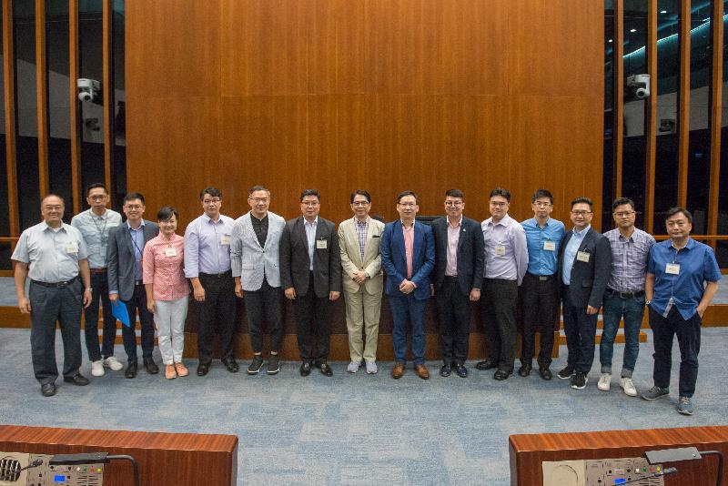 Members of the Legislative Council (LegCo) are pictured with members of Wong Tai Sin District Council after a meeting held at the LegCo Complex today (May 29).
