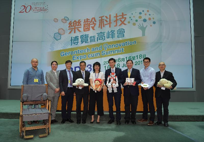 The Head of the Policy and Project Co-ordination Unit of the Chief Secretary for Administration’s Private Office, Ms Doris Ho (centre), the Chief Executive of the Hong Kong Council of Social Service, Mr Chua Hoi-wai (fourth right) and the Chief Executive Officer of the Hong Kong Science and Technology Parks Corporation, Mr Albert Wong (fourth left) with representatives of some exhibitors at the press conference today (May 31), namely Mr K T Chun (first left), Mr Stephen Chiu (second left), Mr Hoosang Lee (third left), Mr Simon Wong (third right), Mr Alan Kwok (second right) and Mr Danny Chow (first right).  Some products being showcased include specially designed wheelchair, various robots, smart phone book and 3D printed food.