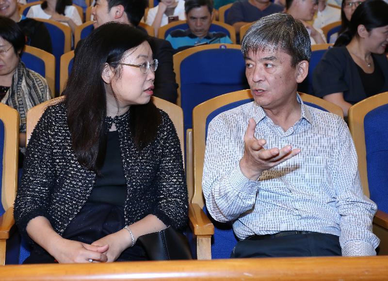 The Director of the Office of the Government of the Hong Kong Special Administrative Region in Beijing, Ms Gracie Foo (left), greets the Director of the Center for Ethnic and Folk Literature and Art Development of the Ministry of Culture, Mr Li Song before the performance of the Hong Kong Chinese Orchestra in Beijing today (June 3).