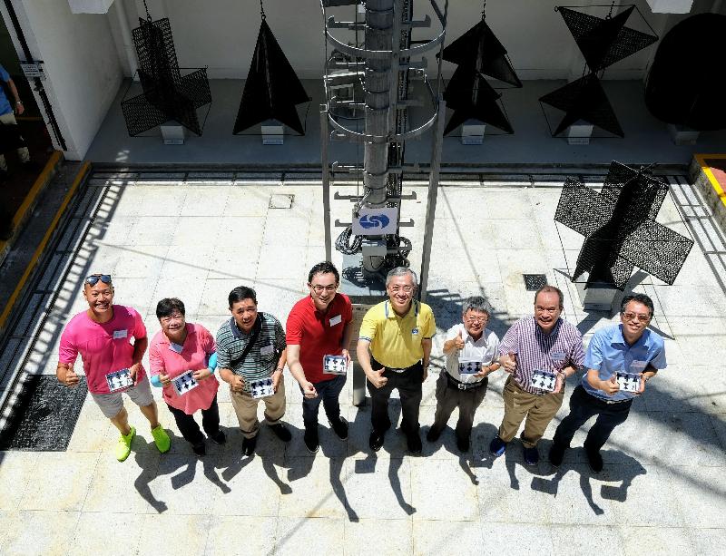 The Director of the Hong Kong Observatory, Mr Shun Chi-ming (fourth right), is pictured with guests at the Cheung Chau Meteorological Station today (June 7).