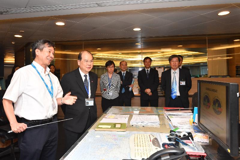 Accompanied by the Director of Marine, Ms Maisie Cheng (third left); the Chief Secretary for Administration, Mr Matthew Cheung Kin-chung (second left), today (June 12) visits the Maritime Rescue Co-ordination Centre of the Marine Department.