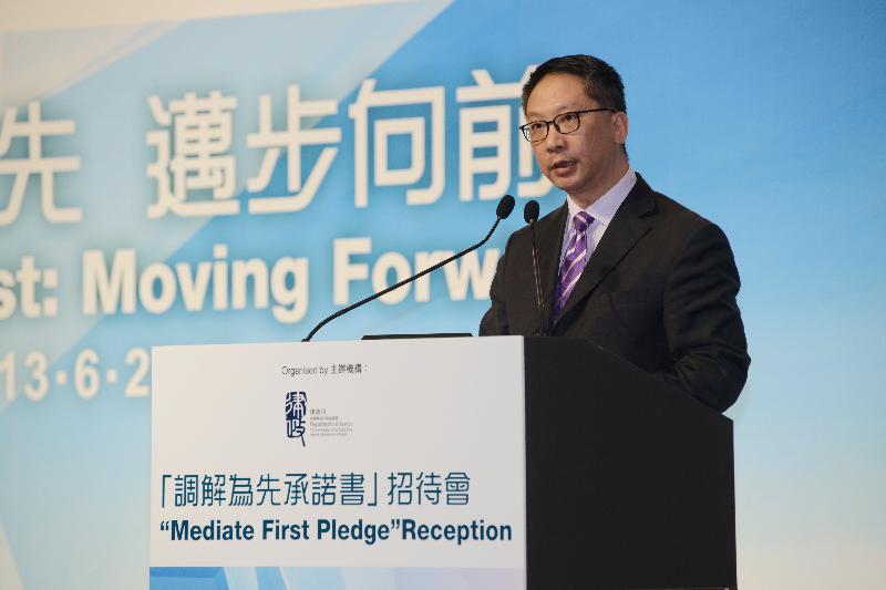 The Secretary for Justice, Mr Rimsky Yuen, SC, delivers a speech at the "Mediate First" Pledge Reception today (June 13).