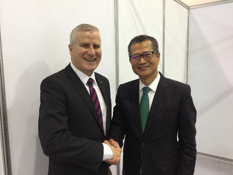 The Financial Secretary, Mr Paul Chan, today (June 16) attends the Second Annual Meeting of the Board of Governors of the Asian Infrastructure Investment Bank in Jeju, Korea. Photo shows Mr Chan (right) meeting with the Minister for Small Business of Australia, Mr Michael McCormack, who is representing Australia to attend the Meeting.