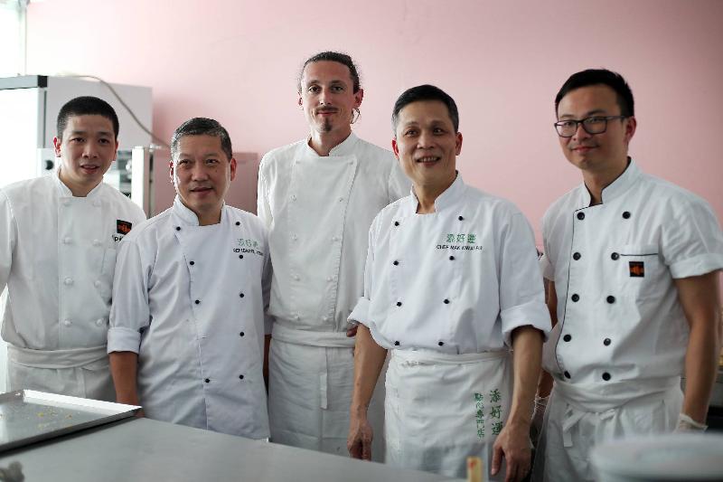 A Hong Kong restaurant opened at Vinexpo in Bordeaux, France, on June 18 (Bordeaux time) to promote Hong Kong as Asia's culinary capital to French and international visitors. Photo shows chefs (from left) Mr Yip Kar-on, Mr Leung Fai-keung, Mr Jérôme Billot, Mr Mak Kwai-pui and Mr Ting Wai-lam who collaborated to prepare a special menu for the Hong Kong restaurant at Vinexpo.