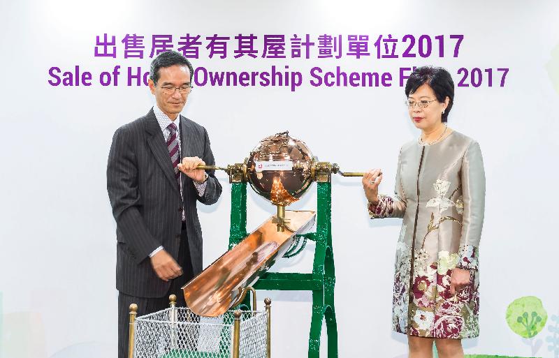 The Chairman of the Subsidised Housing Committee of the Hong Kong Housing Authority (HA), Mr Stanley Wong (left), accompanied by the Assistant Director of Housing (Housing Subsidies), Mrs Rosa Ho, draws ballots today (June 22) for the HA's Sale of Home Ownership Scheme Flats 2017 to decide the sequence of detailed eligibility vetting and flat selection priority.