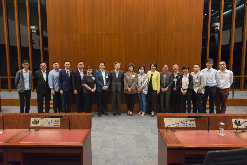 Members of the Legislative Council (LegCo) and Kwai Tsing District Council pictured after the meeting held at the LegCo Complex today (June 23).