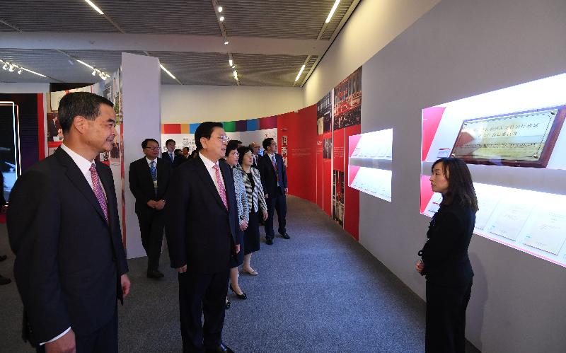 Member of the Standing Committee of the Political Bureau of the CPC Central Committee and Chairman of the Standing Committee of the National People's Congress Mr Zhang Dejiang (second left), accompanied by the Chief Executive, Mr C Y Leung (first left), and the Chief Executive-elect, Mrs Carrie Lam (third left), tours "Together · Progress · Opportunity - Exhibition in Celebration of the 20th Anniversary of the Return of Hong Kong to the Motherland" in Beijing today (June 26). Picture shows Mr Zhang, Mr Leung and Mrs Lam being briefed on the “one country, two systems” section.