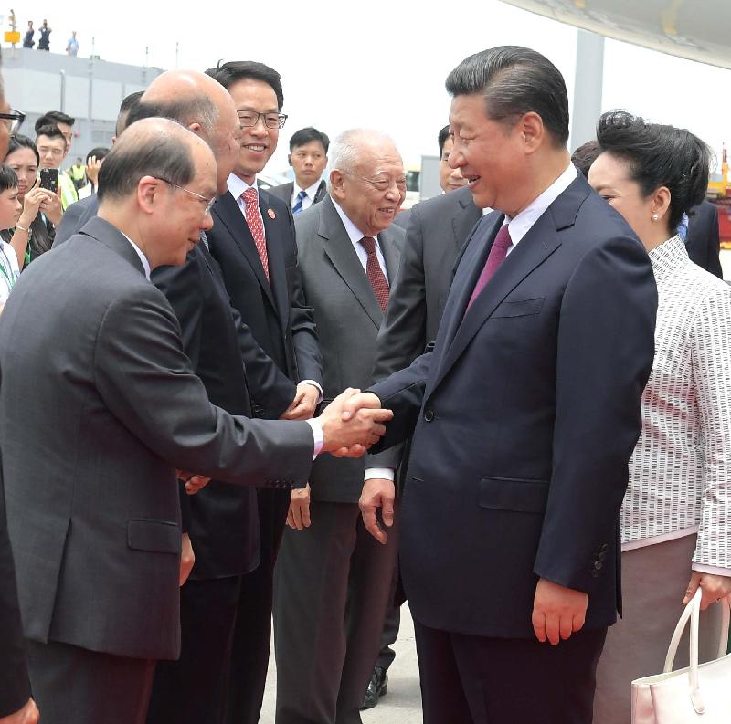 The Chief Secretary for Administration, Mr Matthew Cheung Kin-chung (first left), greets President Xi Jinping (second right) and his wife Peng Liyuan (first right) at the airport apron today (June 29). Looking on are the Vice-Chairman of the National Committee of the Chinese People's Political Consultative Conference, Mr Tung Chee Hwa (fourth left); the Director of the Liaison Office of the Central People's Government in the Hong Kong Special Administrative Region, Mr Zhang Xiaoming (third left); and the Chief Justice of the Court of Final Appeal, Mr Geoffrey Ma Tao-li (second left).