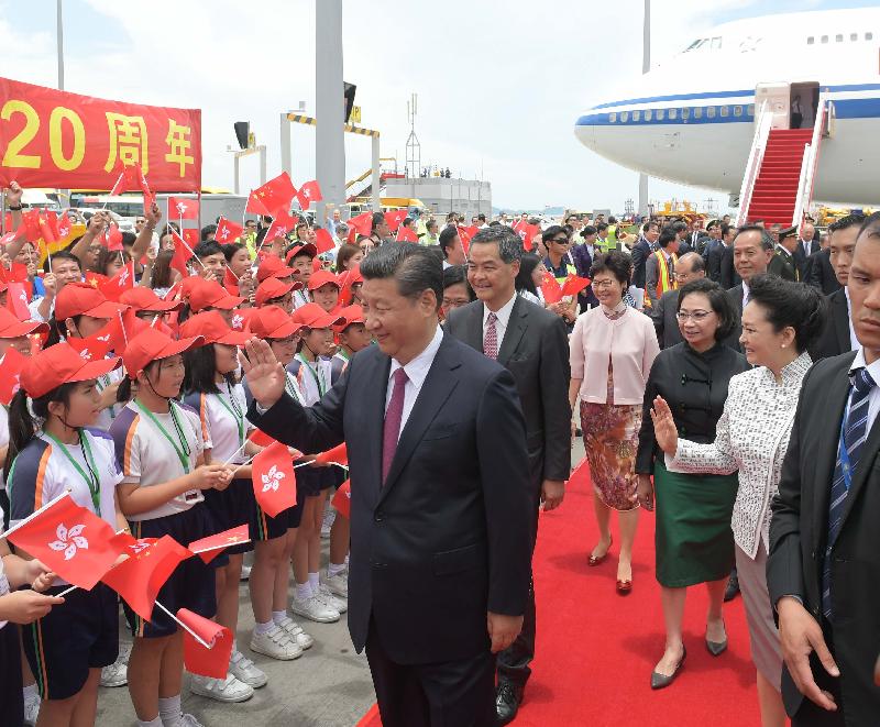 President Xi Jinping (first left) is warmly welcomed at the airport apron on his arrival in Hong Kong today (June 29). Looking on are the Chief Executive, Mr C Y Leung (second left), and his wife Mrs Regina Leung (third right); the Chief Executive-elect, Mrs Carrie Lam (third left); and the wife of President Xi, Peng Liyuan (second right).