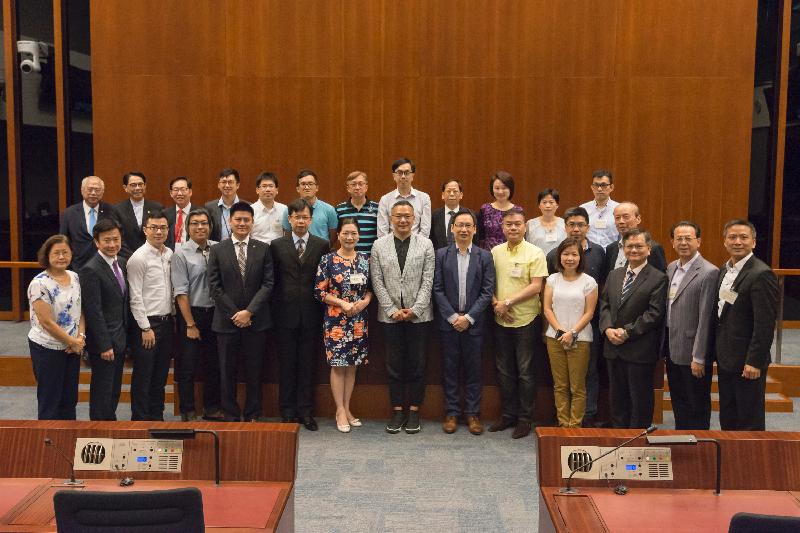 Members of the Legislative Council (LegCo) and Kwun Tong District Council pictured after the meeting held at the LegCo Complex today (June 30).