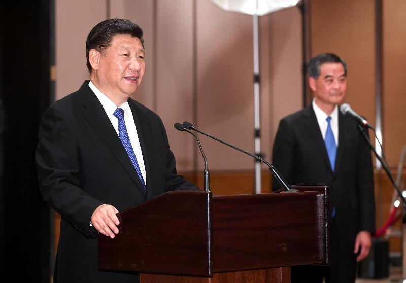 President Xi Jinping (left) meets with some 200 people from various sectors of Hong Kong and delivers remarks at the Hong Kong Convention and Exhibition Centre today (June 30). On his left is the Chief Executive, Mr C Y Leung. 