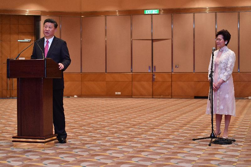 President Xi Jinping (left), accompanied by the new Chief Executive, Mrs Carrie Lam (right), speaks at a meeting with members of the executive, legislature and judiciary today (July 1).