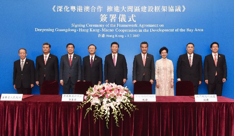 President Xi Jinping (centre) is pictured with (from left) the Director of the Hong Kong and Macao Affairs Office of the State Council, Mr Wang Guangya; the Governor of Guangdong Province, Mr Ma Xingrui; the Chairman of the National Development and Reform Commission, Mr He Lifeng; State Councillor Mr Yang Jiechi; Vice-Chairman of the National Committee of the Chinese People's Political Consultative Conference Mr C Y Leung; the Chief Executive of the Hong Kong Special Administrative Region, Mrs Carrie Lam; the Chief Executive of the Macao Special Administrative Region, Mr Chui Sai-on; and the Director of the Liaison Office of the Central People's Government in the Hong Kong Special Administrative Region, Mr Zhang Xiaoming, at the Signing Ceremony of the Framework Agreement on Deepening Guangdong-Hong Kong-Macao Cooperation in the Development of the Bay Area today (July 1).