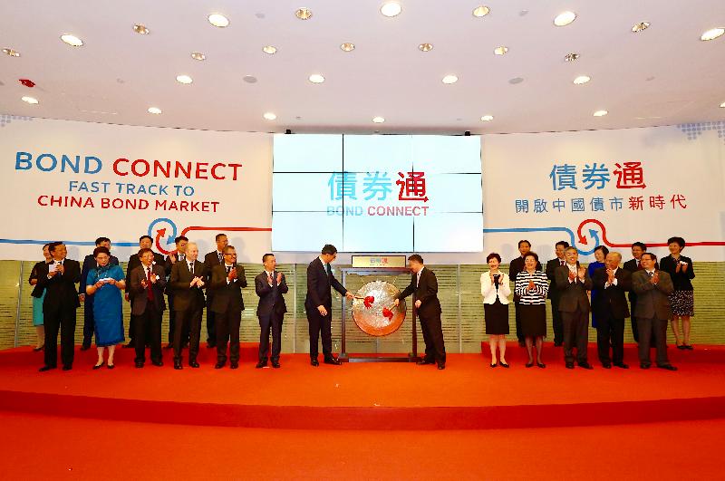 The Chief Executive, Mrs Carrie Lam, attended the Bond Connect launch ceremony today (July 3). Picture shows Mrs Lam (front row; fifth right); Deputy Director of the Hong Kong and Macao Affairs Office of the State Council Mr Huang Liuquan (front row; sixth left); Deputy Director of the Liaison Office of the Central People's Government in the Hong Kong Special Administrative Region Ms Qiu Hong (front row; fourth right); the Financial Secretary, Mr Paul Chan (front row; fifth left); the Chairman of the Board of Directors of the Hong Kong Exchanges and Clearing Limited (HKEX), Mr Chow Chung-kong (front row; second right); the Chief Executive Officer of the Securities and Futures Commission, Mr Ashley Alder (front row; fourth left); the Chief Executive of the HKEX, Mr Charles Li (front row; first left); and other guests witnessing Deputy Governor of the People's Bank of China Mr Pan Gongsheng (front row; sixth right) and the Chief Executive of the Hong Kong Monetary Authority, Mr Norman Chan (front row; seventh left), officiating at the launch ceremony. 
