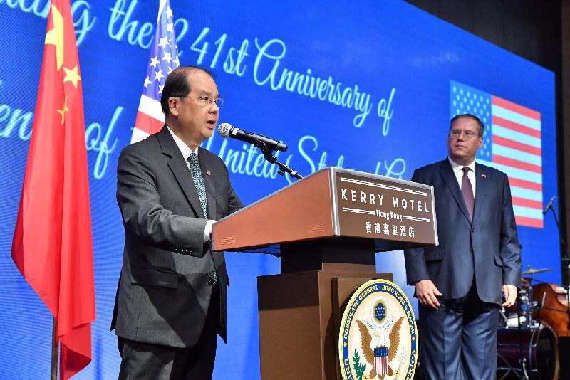 The Chief Secretary for Administration, Mr Matthew Cheung Kin-chung (left), addresses a reception held by the United States (US) Consulate General in Hong Kong and Macau in celebration of US Independence Day and the 20th anniversary of US-Hong Kong relations under the "one country, two systems" framework this evening (July 5).