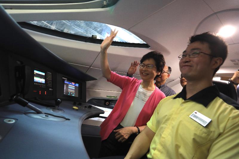 The Chief Executive, Mrs Carrie Lam, visited the Shek Kong Stabling Sidings of the Hong Kong section of the Guangzhou-Shenzhen-Hong Kong Express Rail Link (XRL) this morning (July 9) and viewed the XRL train which has been delivered to Hong Kong. Photo shows Mrs Lam (first left) viewing a driving cab.