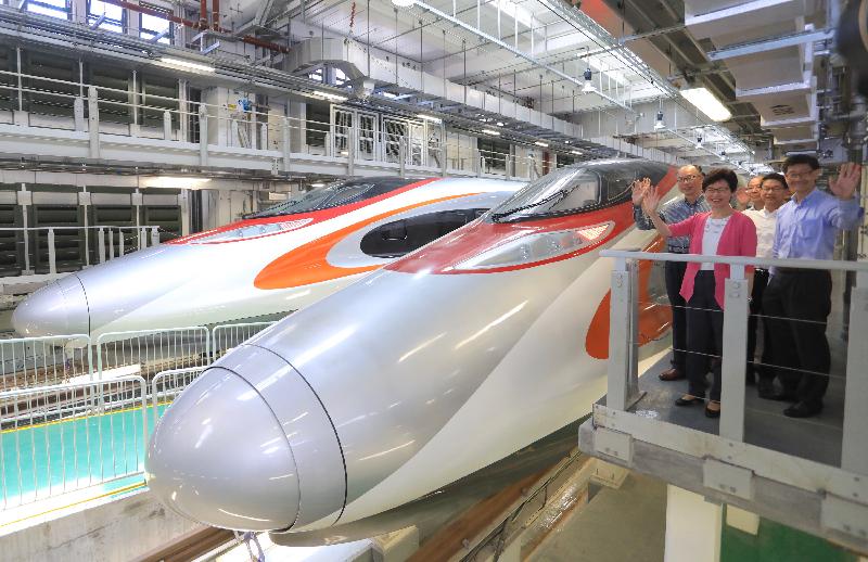 The Chief Executive, Mrs Carrie Lam, visited the Shek Kong Stabling Sidings of the Hong Kong section of the Guangzhou-Shenzhen-Hong Kong Express Rail Link (XRL) this morning (July 9) and viewed the XRL train which has been delivered to Hong Kong. Photo shows Mrs Lam (front); and the Secretary for Transport and Housing, Mr Frank Chan Fan (back row, first left), next to an XRL train.