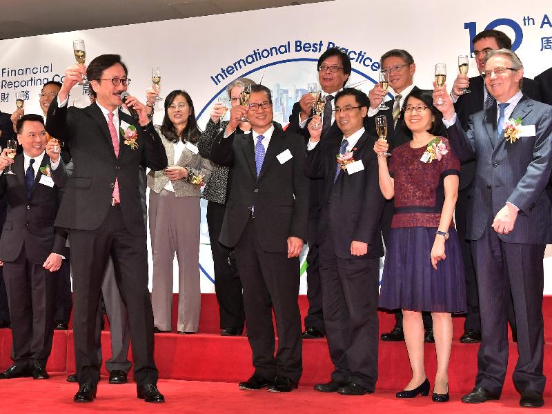 The Financial Secretary, Mr Paul Chan, attended the Financial Reporting Council (FRC) 10th anniversary cocktail reception this evening (July 13). Photo shows Mr Chan (front row, fourth right); and the FRC Chairman, Dr John Poon (front row, second left), proposing a toast with other guests.