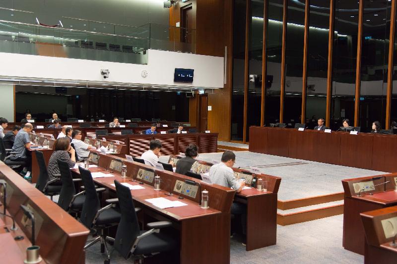 Members of the Legislative Council (LegCo) and Eastern District Council exchange views on the safety issues of "garages in urban areas" at the LegCo Complex today (July 14).
