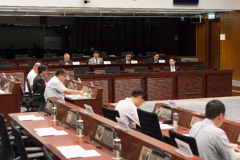 Members of the Legislative Council (LegCo) and Eastern District Council discuss the request for the extension of the MTR Island Line to Siu Sai Wan at the meeting at the LegCo Complex today (July 14).