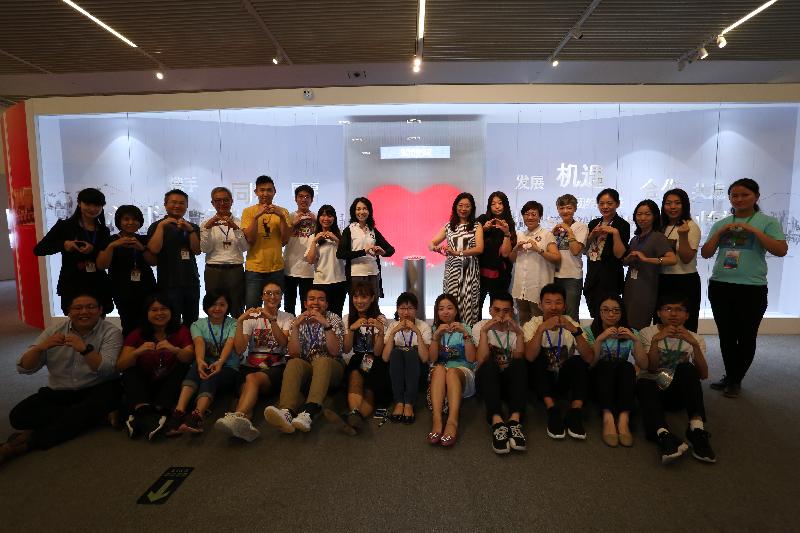 The "Together · Progress · Opportunity - Exhibition in Celebration of the 20th Anniversary of the Return of Hong Kong to the Motherland" organised by the Hong Kong Special Administration Region (HKSAR) Government at the National Museum of China in Beijing was successfully concluded today (July 16). During the exhibition, the "heart-beat" interactive installation collected a total of 900 998 "heart beats", far exceeding expectation. The Director of the Office of the HKSAR Government in Beijing, Ms Gracie Foo (eighth right); and Deputy Director, Miss Winnie So (eighth left); are pictured with working staff in front of the "heart-beat" interactive installation when the exhibition drew to a close today.