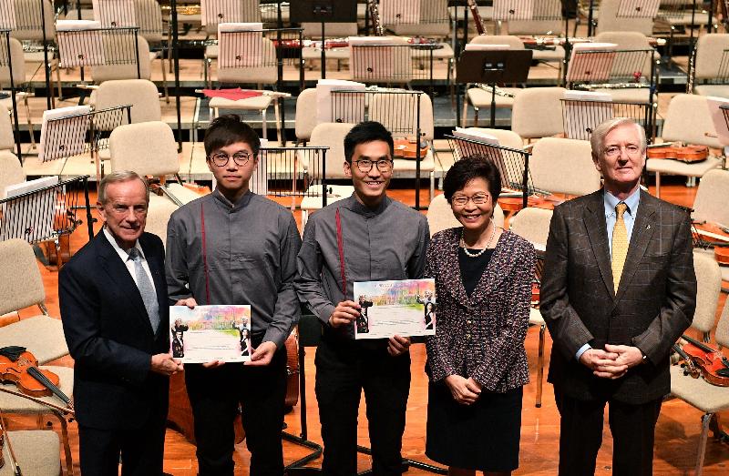 The Chief Executive, Mrs Carrie Lam, attended the 27th Asian Youth Orchestra (AYO) Summer Festival and World Tour Opening Ceremony at the Hong Kong Academy for Performing Arts this evening (July 17). Photo shows Mrs Lam (second right) presenting a scholarship certificate to an AYO representative.