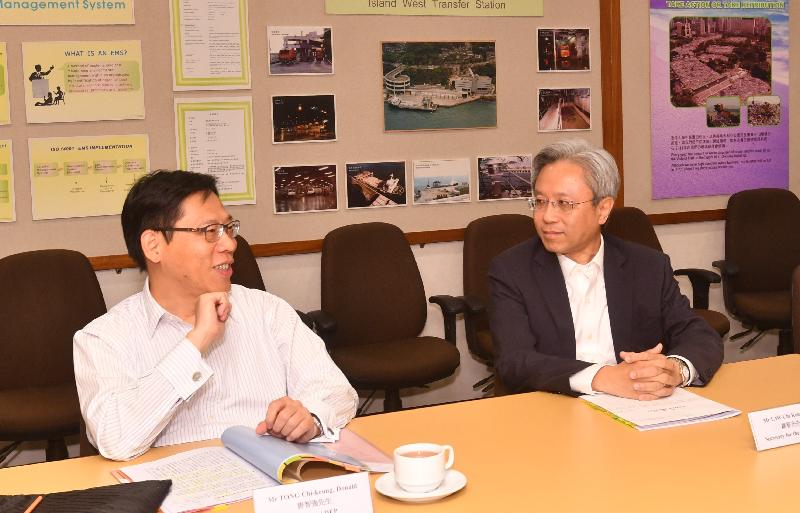 The Secretary for the Civil Service, Mr Joshua Law (right), visited the Environmental Protection Department today (July 18). He is pictured meeting with the Permanent Secretary for the Environment/Director of Environmental Protection, Mr Donald Tong, to take a closer look at the work and services of the department.