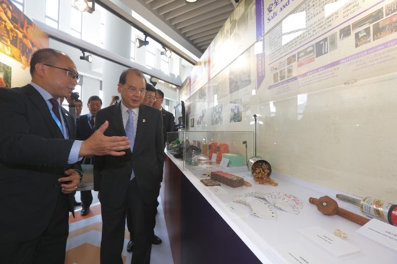 The Chief Secretary for Administration, Mr Matthew Cheung Kin-chung (right), tours an exhibition at Conference 2017 - Evolution of Corrections held by the Correctional Services Department at the City University of Hong Kong today (July 19).